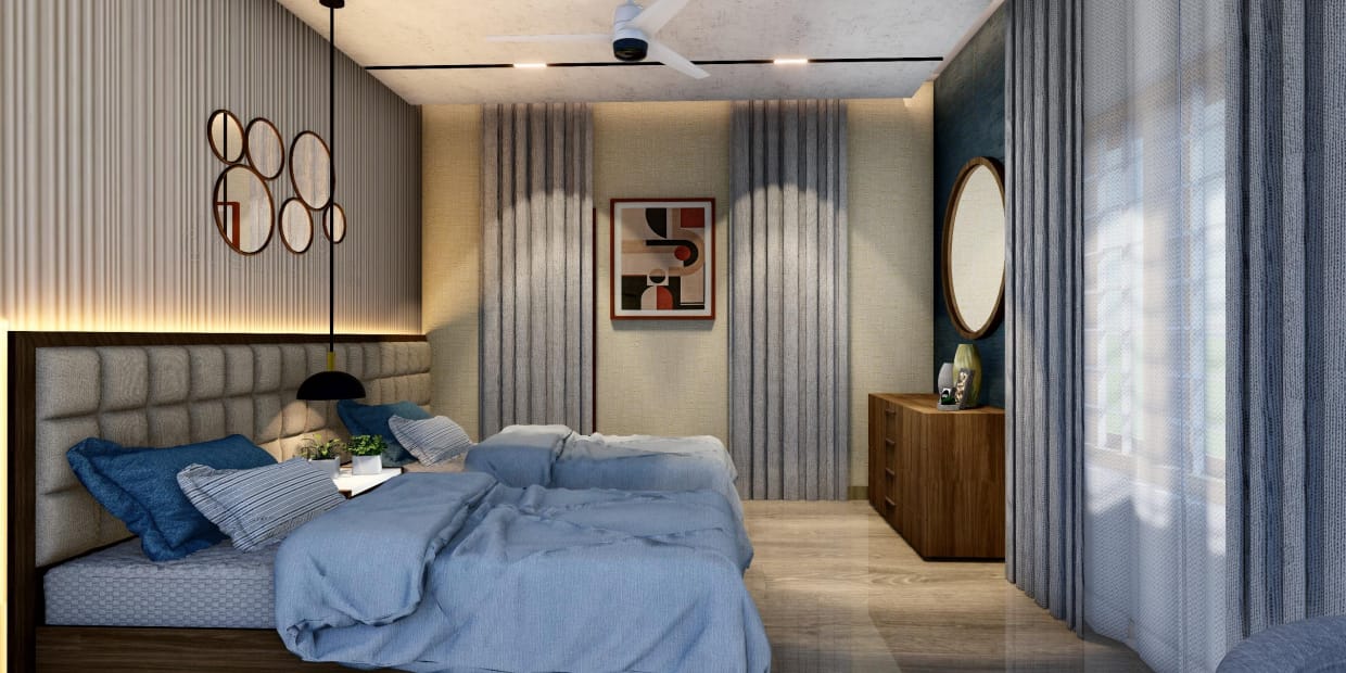 Twin bedroom with quilted headboard wall, cluster of round mirrors and blue bedding